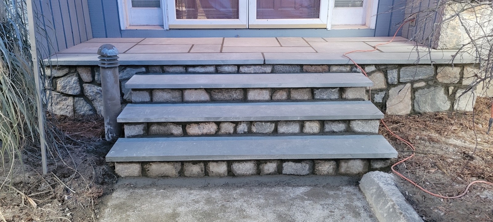 After masonry pool setting with finished stone steps and updated hardscape detailing